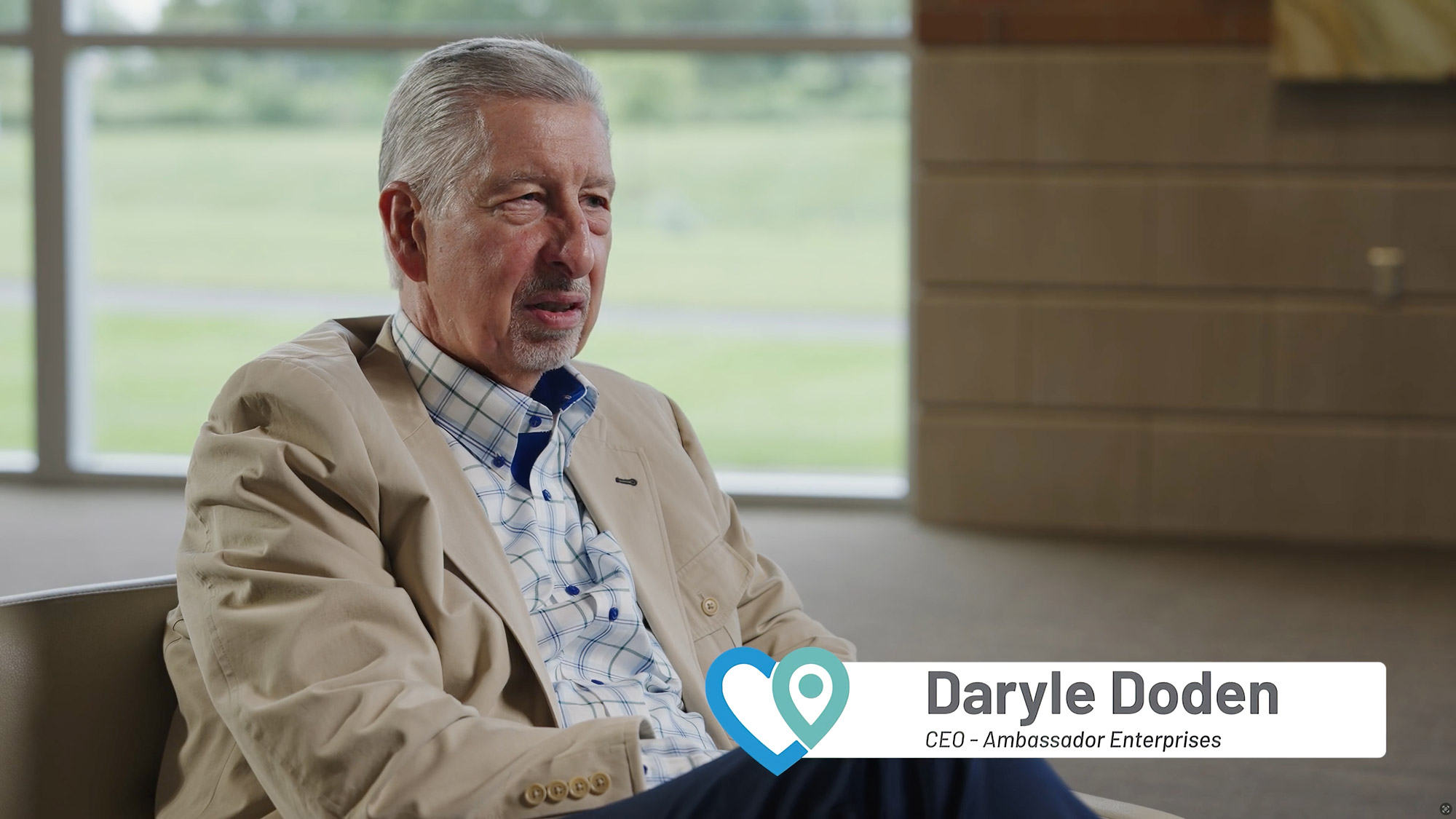 Daryle sitting in a chair during an interview