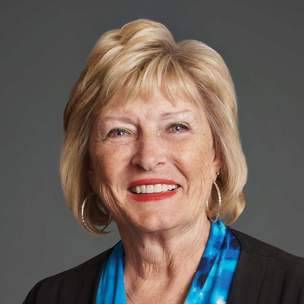 sherilyn emberton smiling on gray background