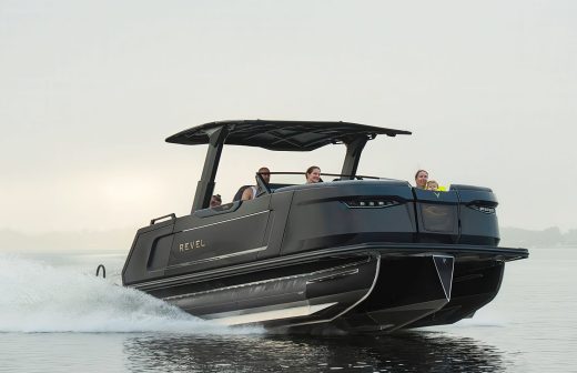 Revel pontoon on the lake with family onboard